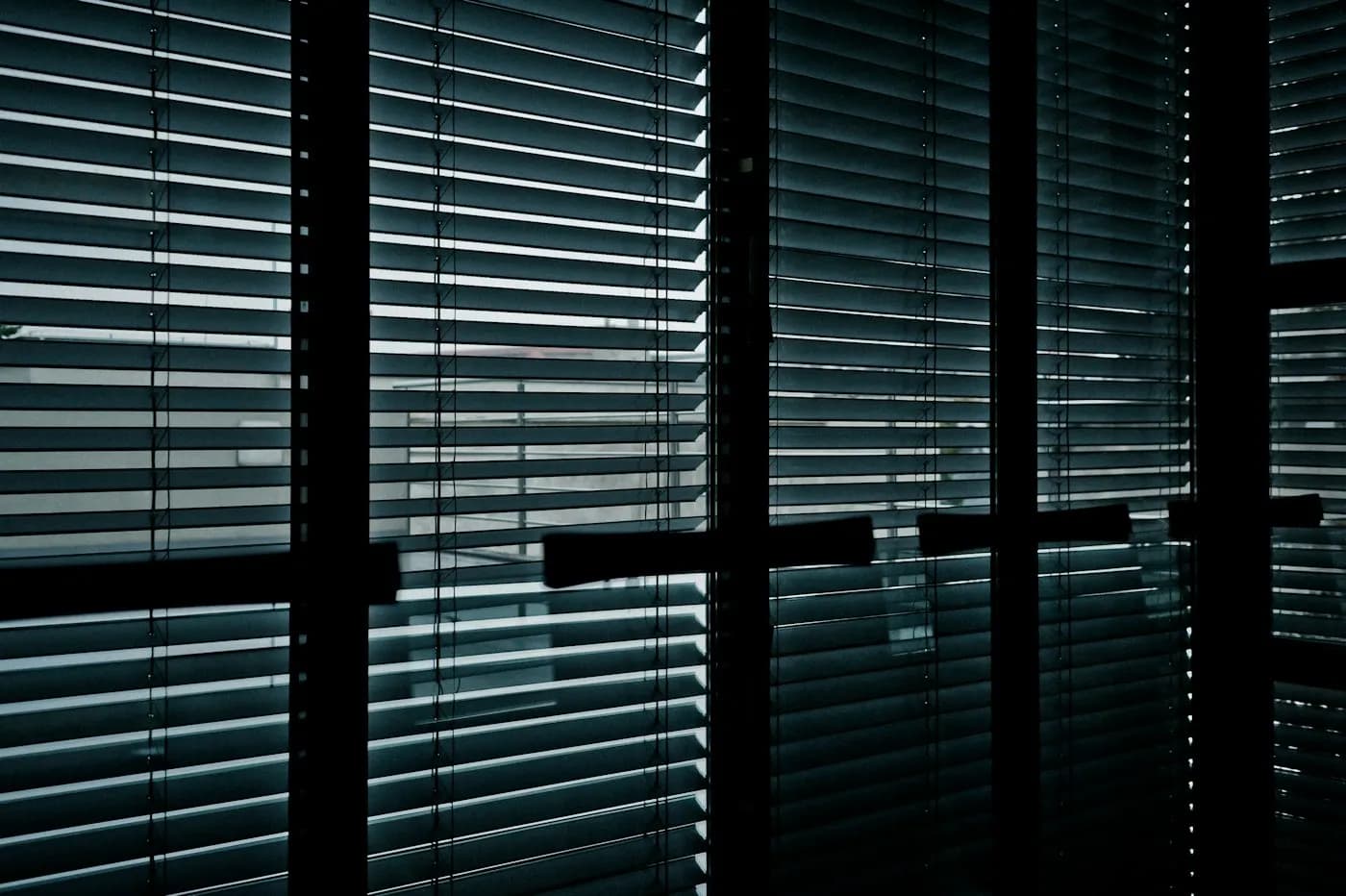 Office windows fitted with blinds to control glare